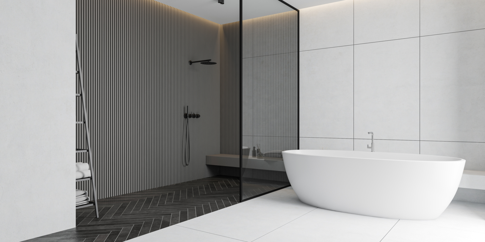 Geräumiges Badezimmer mit freistehender ovaler Badewanne, weiße und graue Wandfliesen